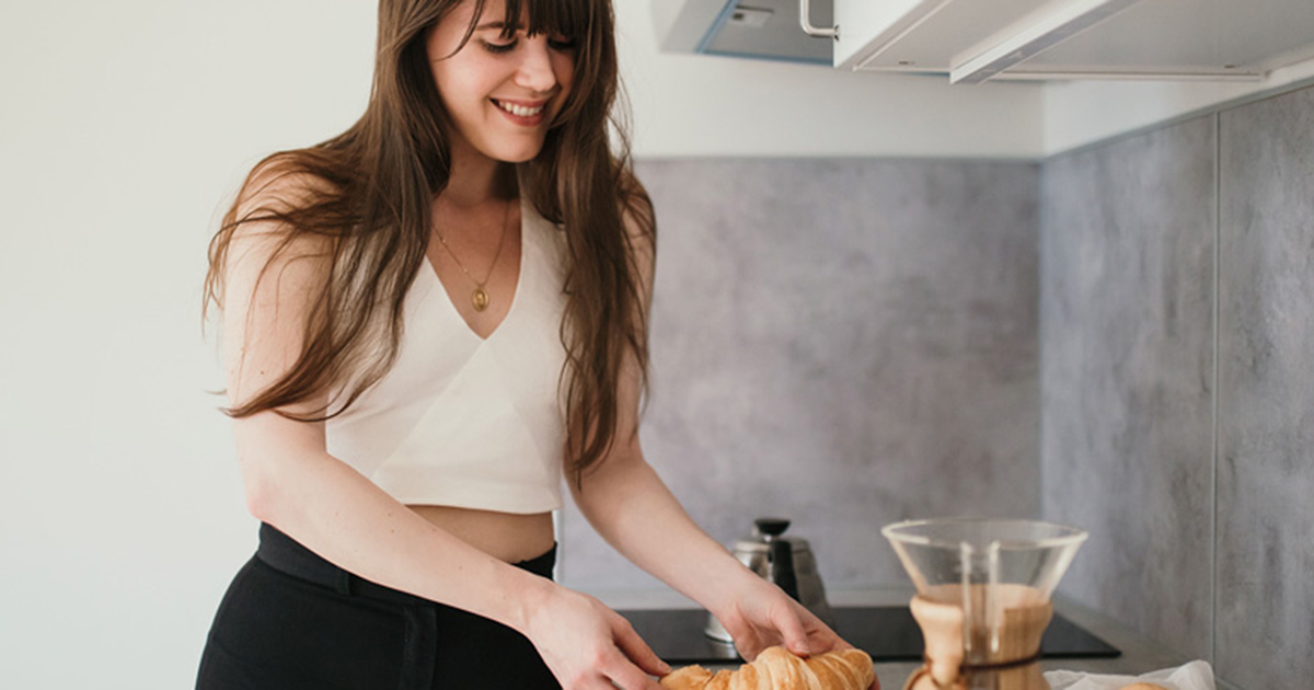 image of woman in kitchen with mold air purifier clean air 